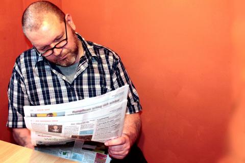 Man reading newspaper